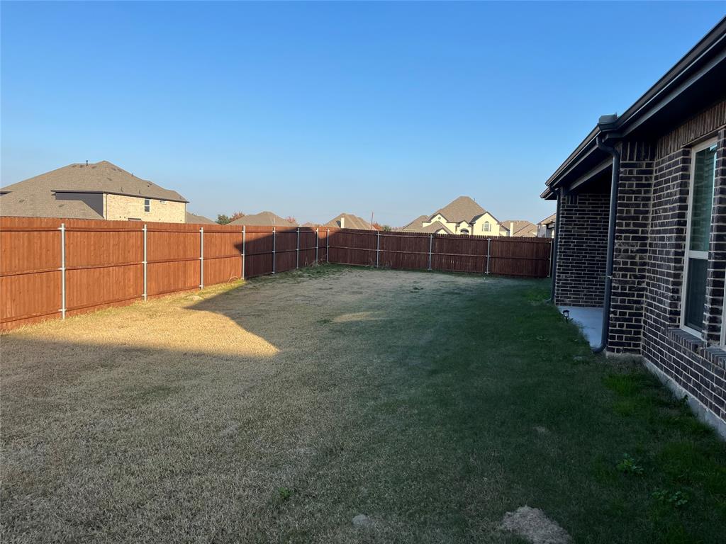 2409 Park Oaks Drive Midlothian, TX 76065 - Photo 7 of 18 a view of a back yard of the house