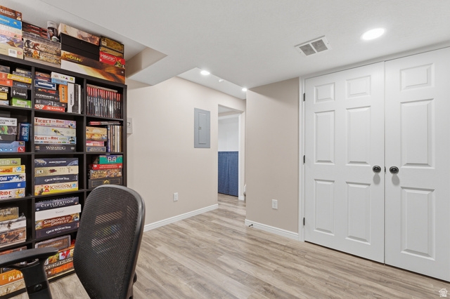 11189 Ohenry Road East Sandy, UT 84070 - Photo 25 of 44 Finished basement space featuring wood-finish flooring, recessed lighting, and a neutral paint palette