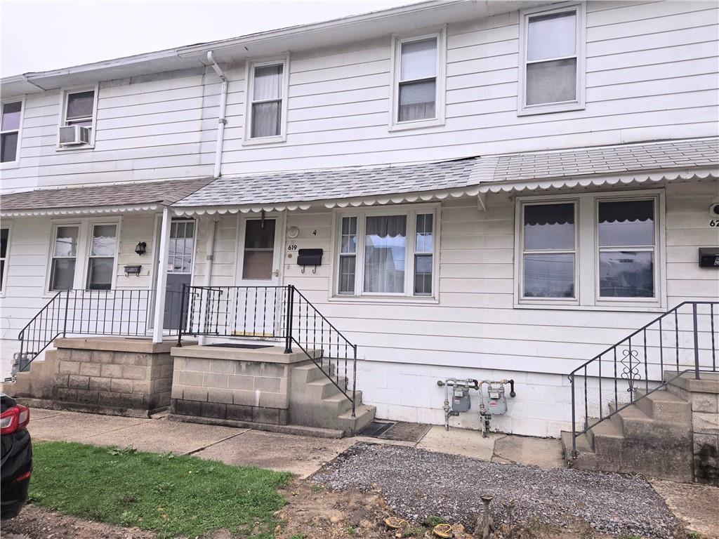 619 12th Street Ford City, PA 16226 - Photo 1 of 22 a view of a house with a small deck and a large window