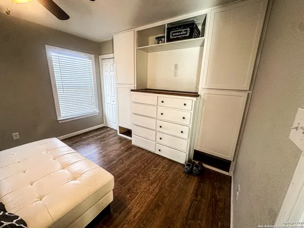 a living room with furniture and flat screen tv
