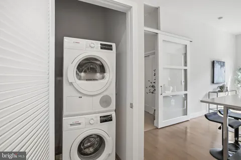 a view of a storage & utility room with sink washer and dryer