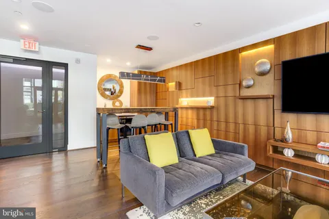a living room with a couch and a flat screen tv