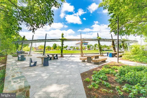 a view of a swimming pool with outdoor seating