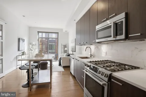 a kitchen with a stove and a sink