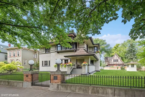 front view of a house with a garden