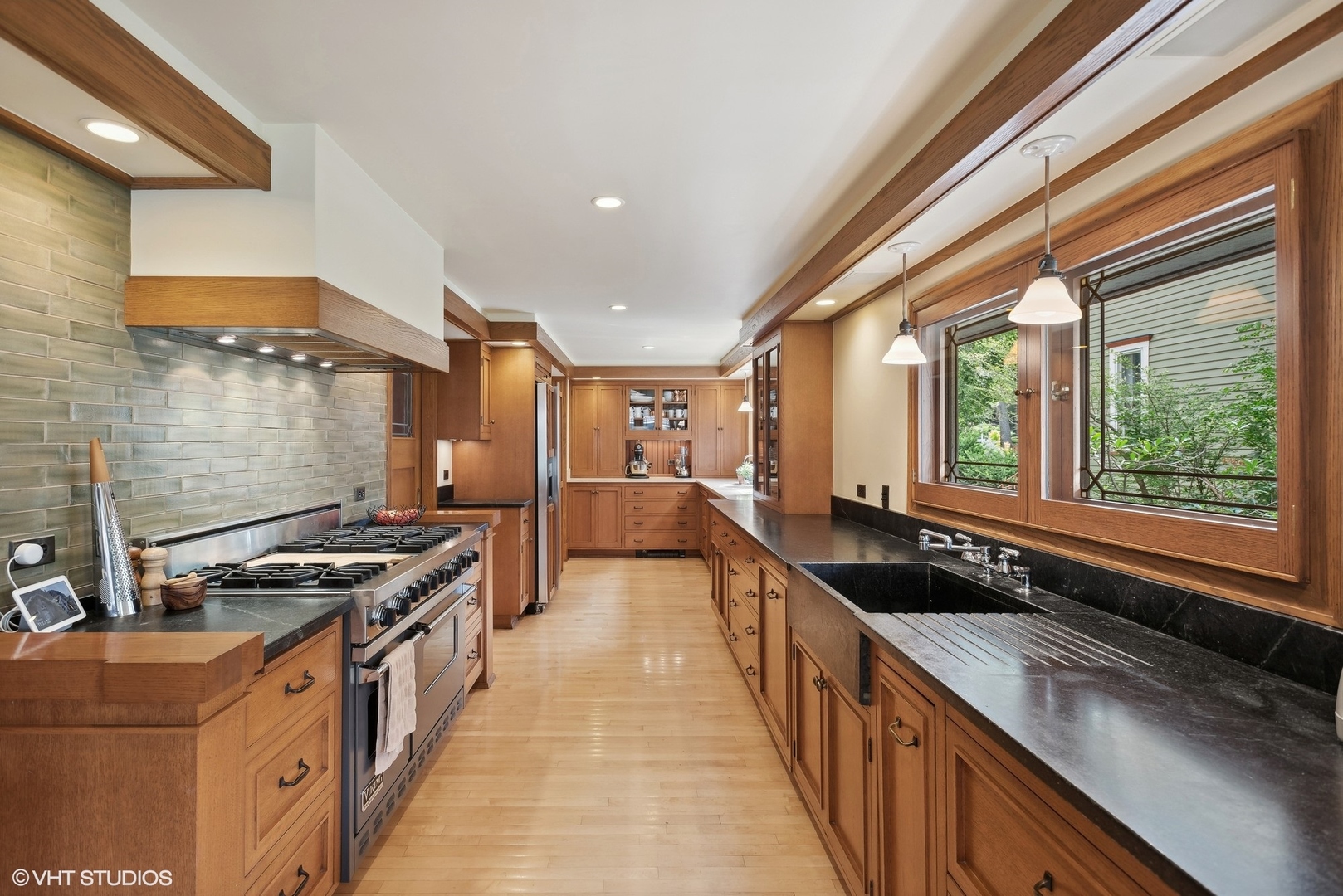 313 Forest Avenue Oak Park, IL 60302 - Photo 15 of 50 a kitchen with stainless steel appliances granite countertop a stove a sink and a microwave