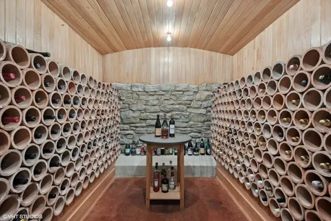 a bathroom with a shower a sink and mirror