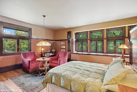 a bedroom with a bed and a fireplace