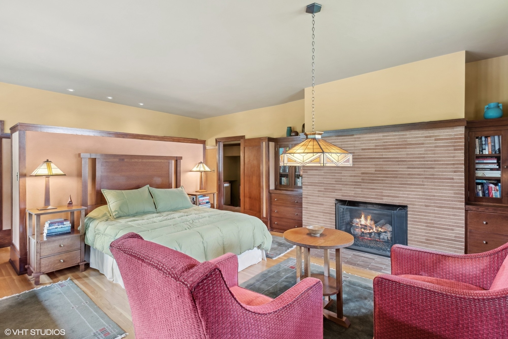 313 Forest Avenue Oak Park, IL 60302 - Photo 35 of 50 a bedroom with a bed and a fireplace