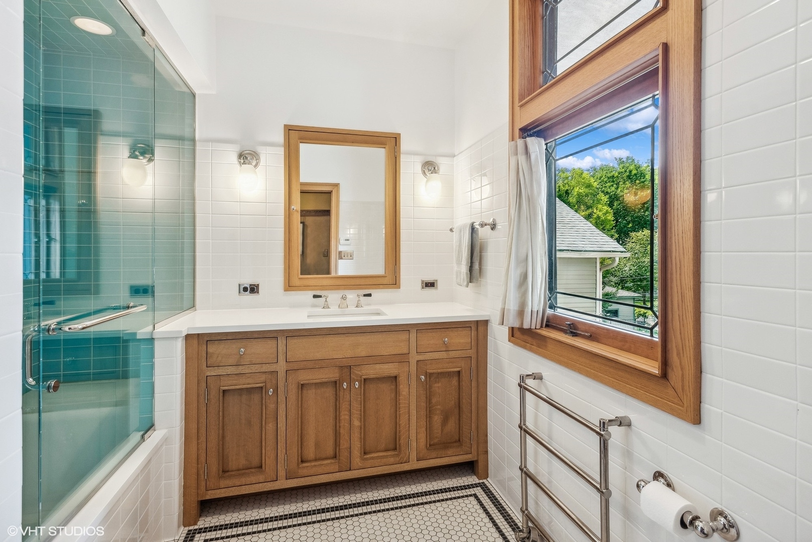 313 Forest Avenue Oak Park, IL 60302 - Photo 40 of 50 a bathroom with a double vanity sink and a mirror