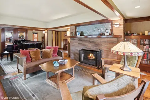a living room with furniture and a fireplace
