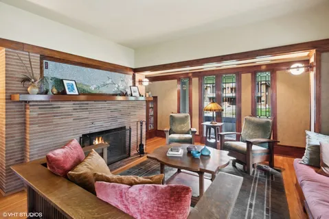 a living room with furniture and a fireplace