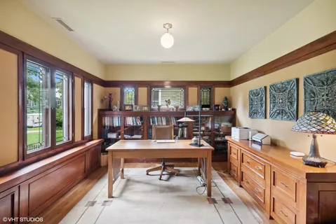 a room with kitchen island granite countertop furniture and a large window
