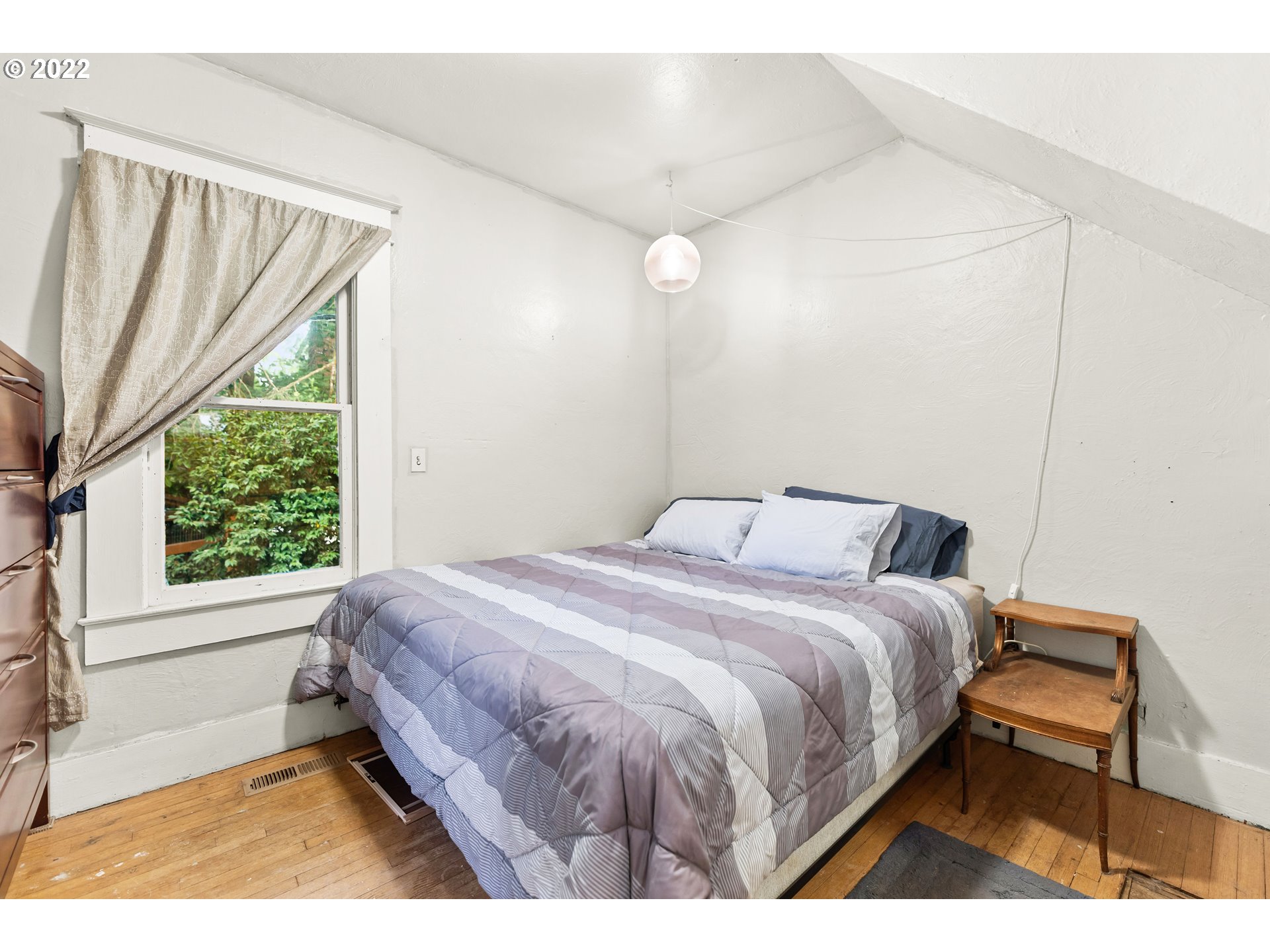 401 Maple Street Ridgefield, WA 98642 - Photo 13 of 31 a bedroom with a bed and a window