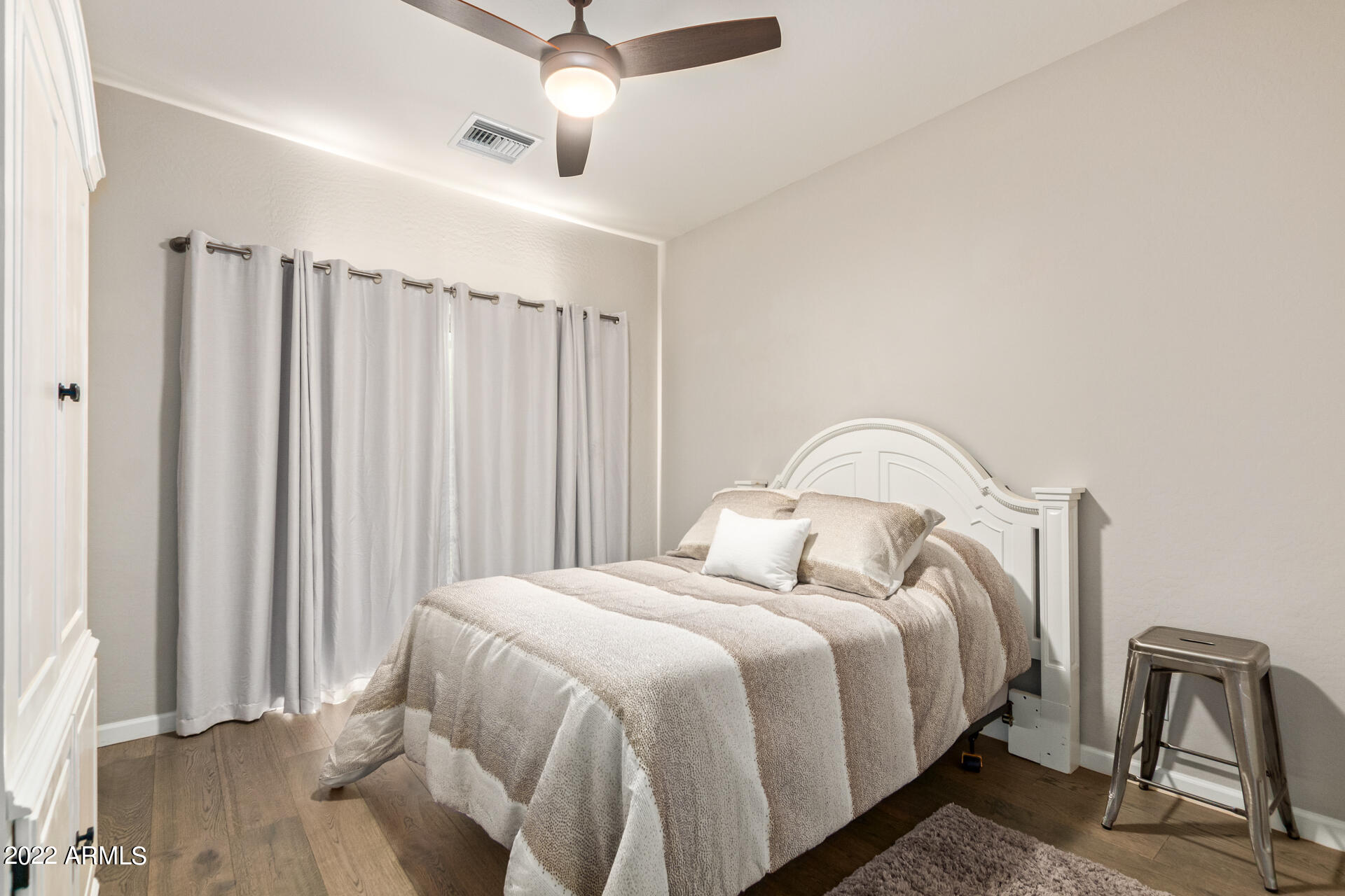 3935 East Rough Rider Road, Unit 1289 Phoenix, AZ 85050 - Photo 13 of 60 a bedroom with bed and a window