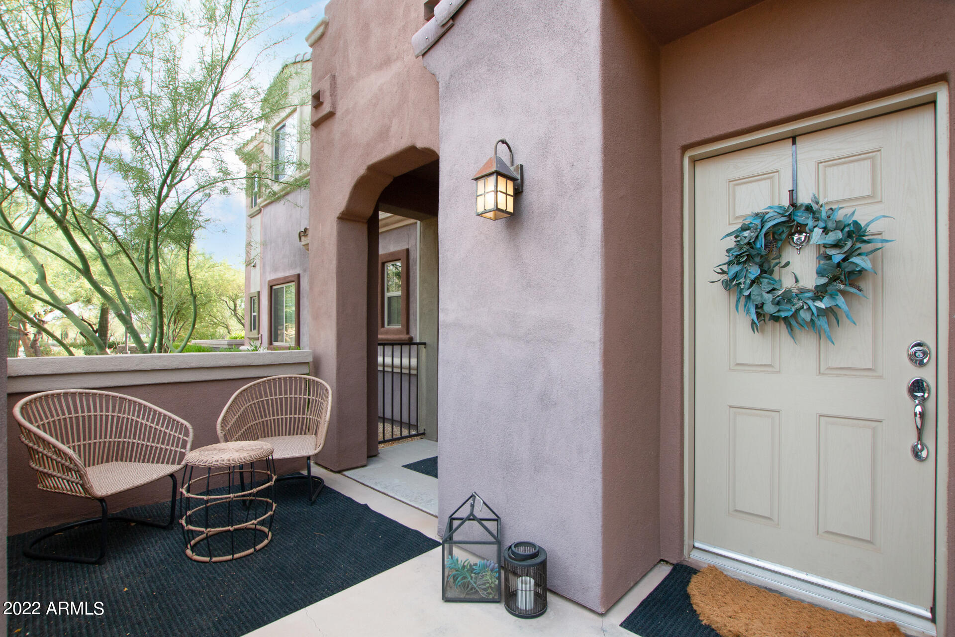 3935 East Rough Rider Road, Unit 1289 Phoenix, AZ 85050 - Photo 28 of 60 a front view of a house with outdoor seating