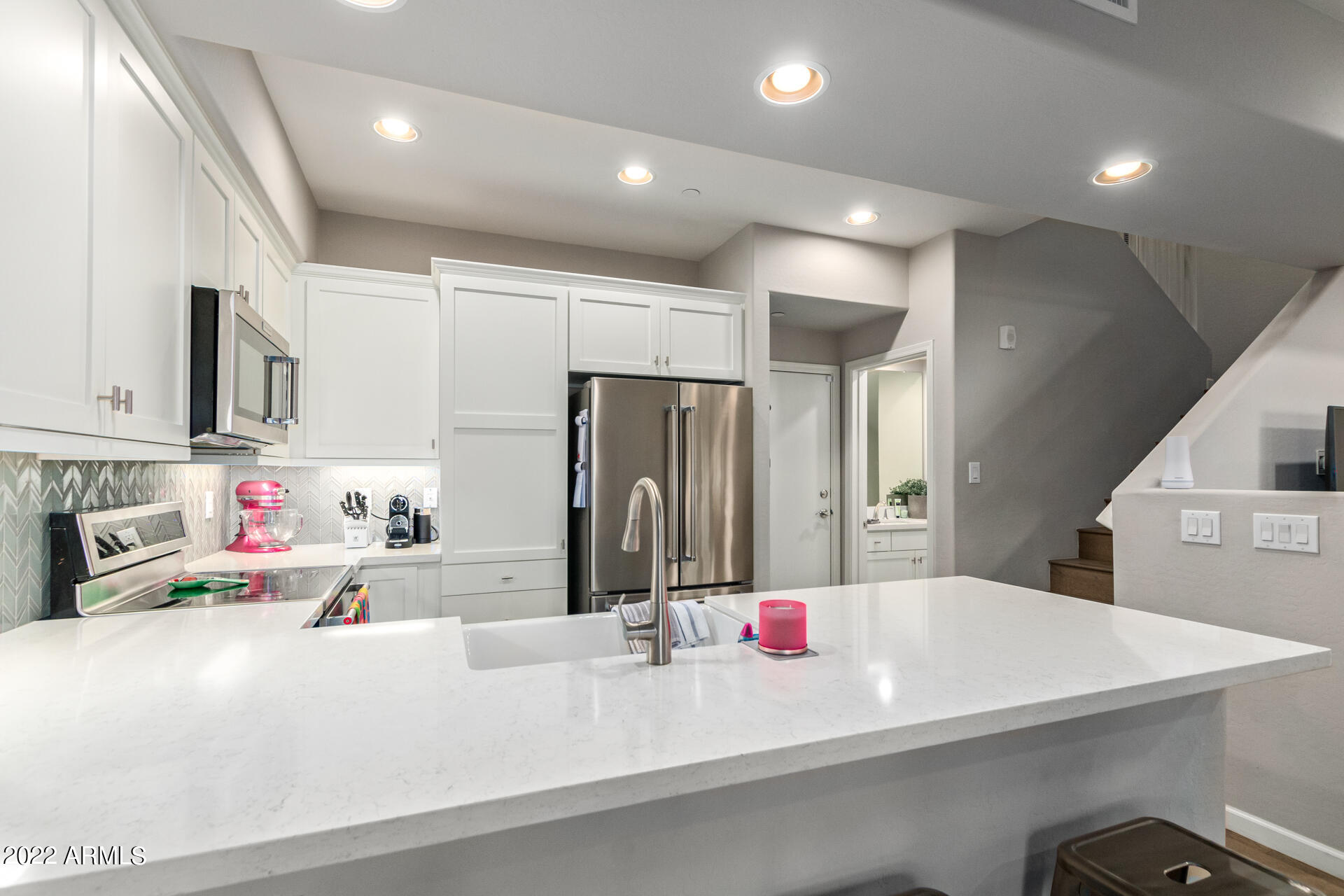 3935 East Rough Rider Road, Unit 1289 Phoenix, AZ 85050 - Photo 34 of 60 a kitchen with refrigerator and cabinets