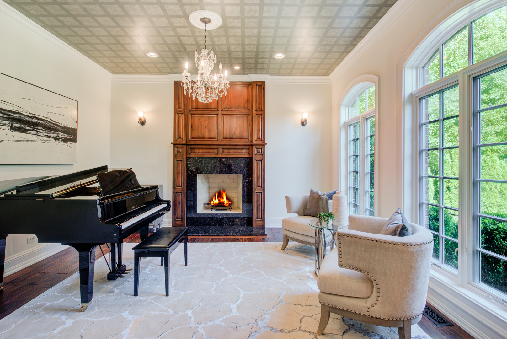 102 Longmeadow Road Winnetka, IL 60093 - Photo 12 of 52 a living room with furniture a fireplace and a chandelier