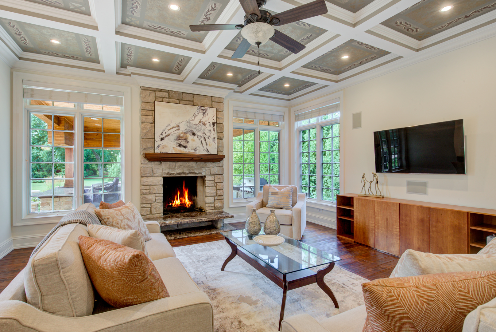 102 Longmeadow Road Winnetka, IL 60093 - Photo 15 of 52 a living room with furniture a fireplace and a flat screen tv