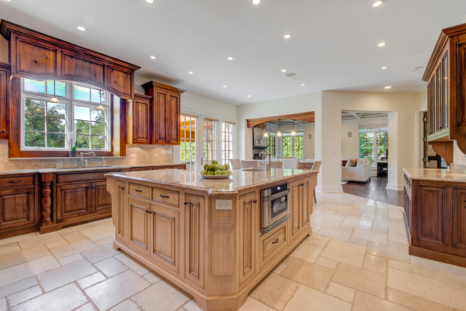 102 Longmeadow Road Winnetka, IL 60093 - Photo 19 of 52 a kitchen with stainless steel appliances granite countertop a stove a sink and a refrigerator
