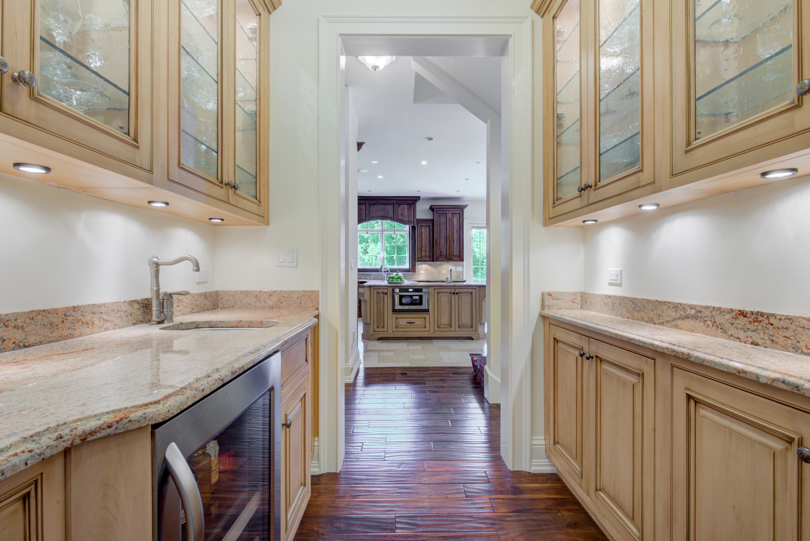 102 Longmeadow Road Winnetka, IL 60093 - Photo 20 of 52 a kitchen with stainless steel appliances granite countertop a sink and wooden cabinets with a granite countertops