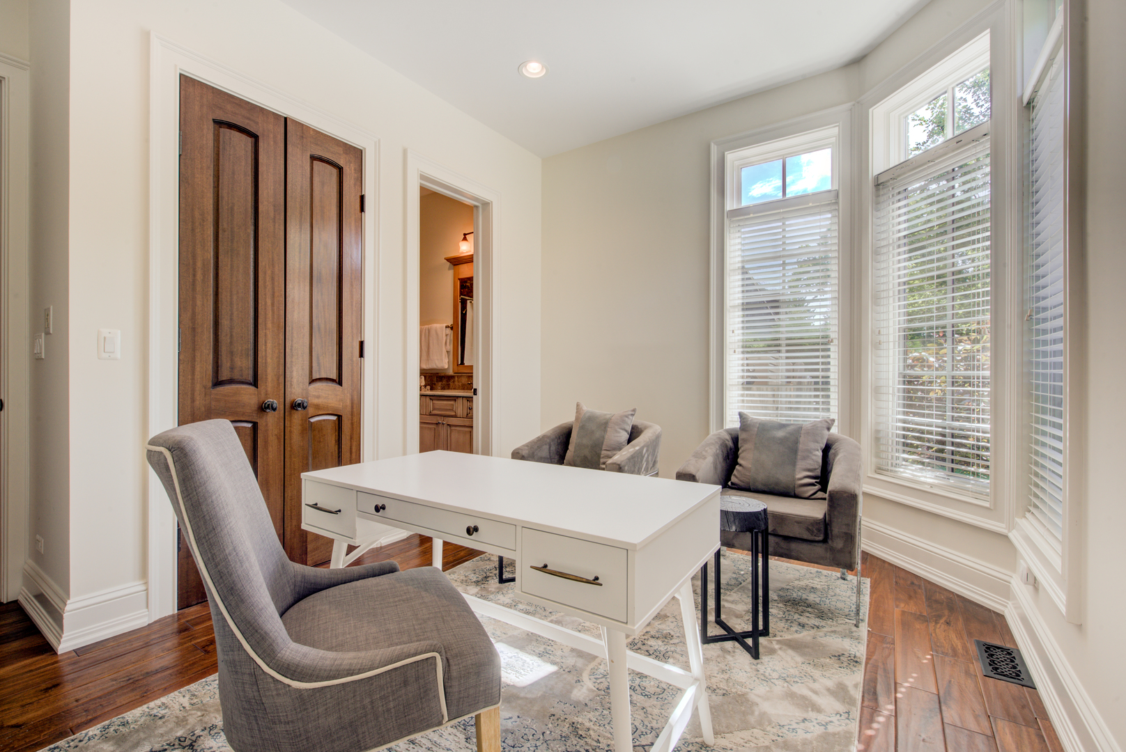 102 Longmeadow Road Winnetka, IL 60093 - Photo 22 of 52 a living room with furniture and a large window