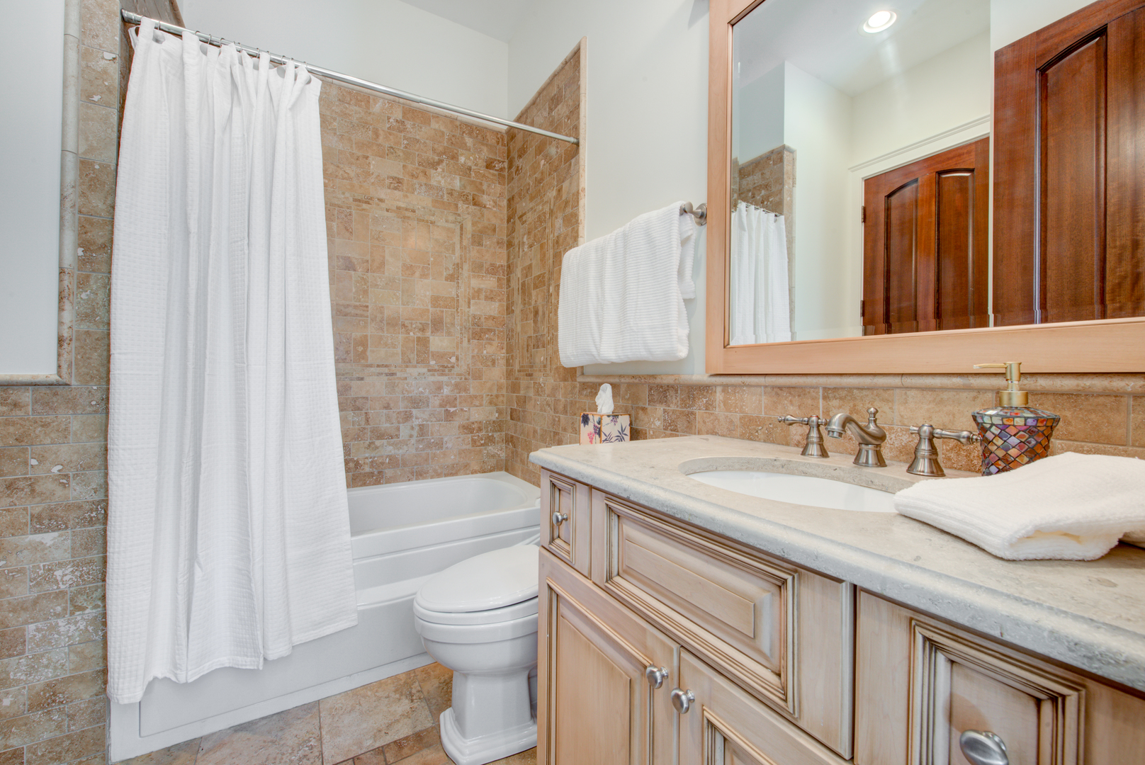 102 Longmeadow Road Winnetka, IL 60093 - Photo 23 of 52 a bathroom with a granite countertop sink a toilet and shower