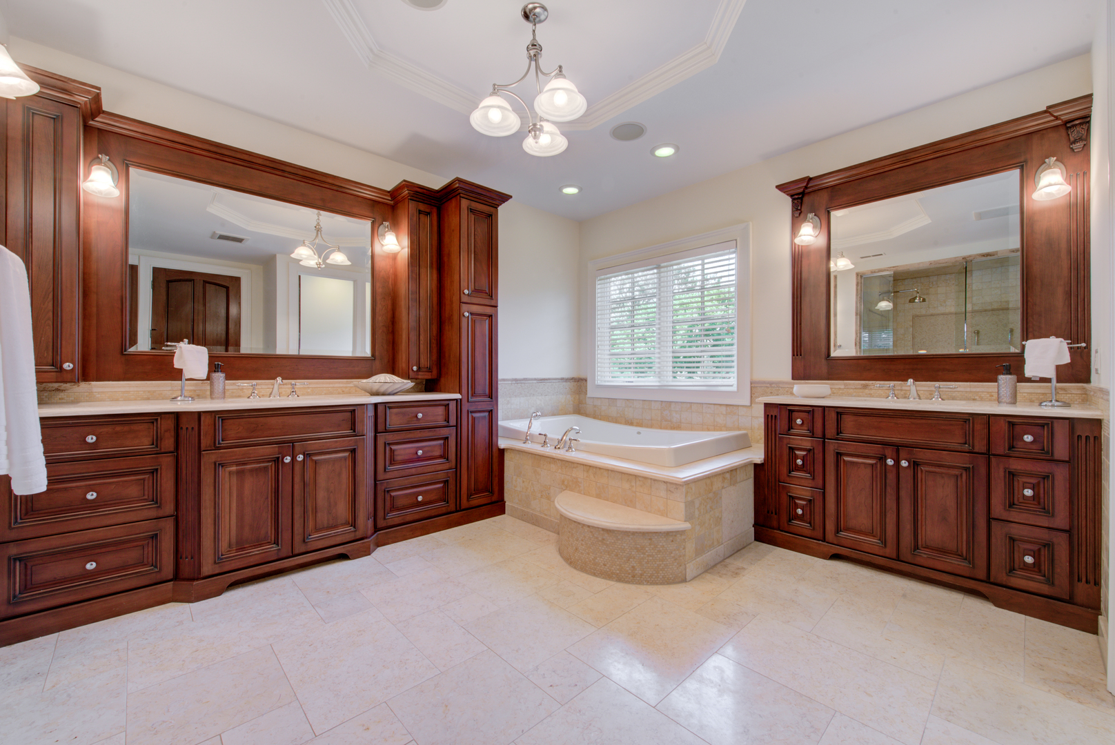 102 Longmeadow Road Winnetka, IL 60093 - Photo 30 of 52 a spacious bathroom with a granite countertop double vanity sink a mirror a bathtub and a vanity