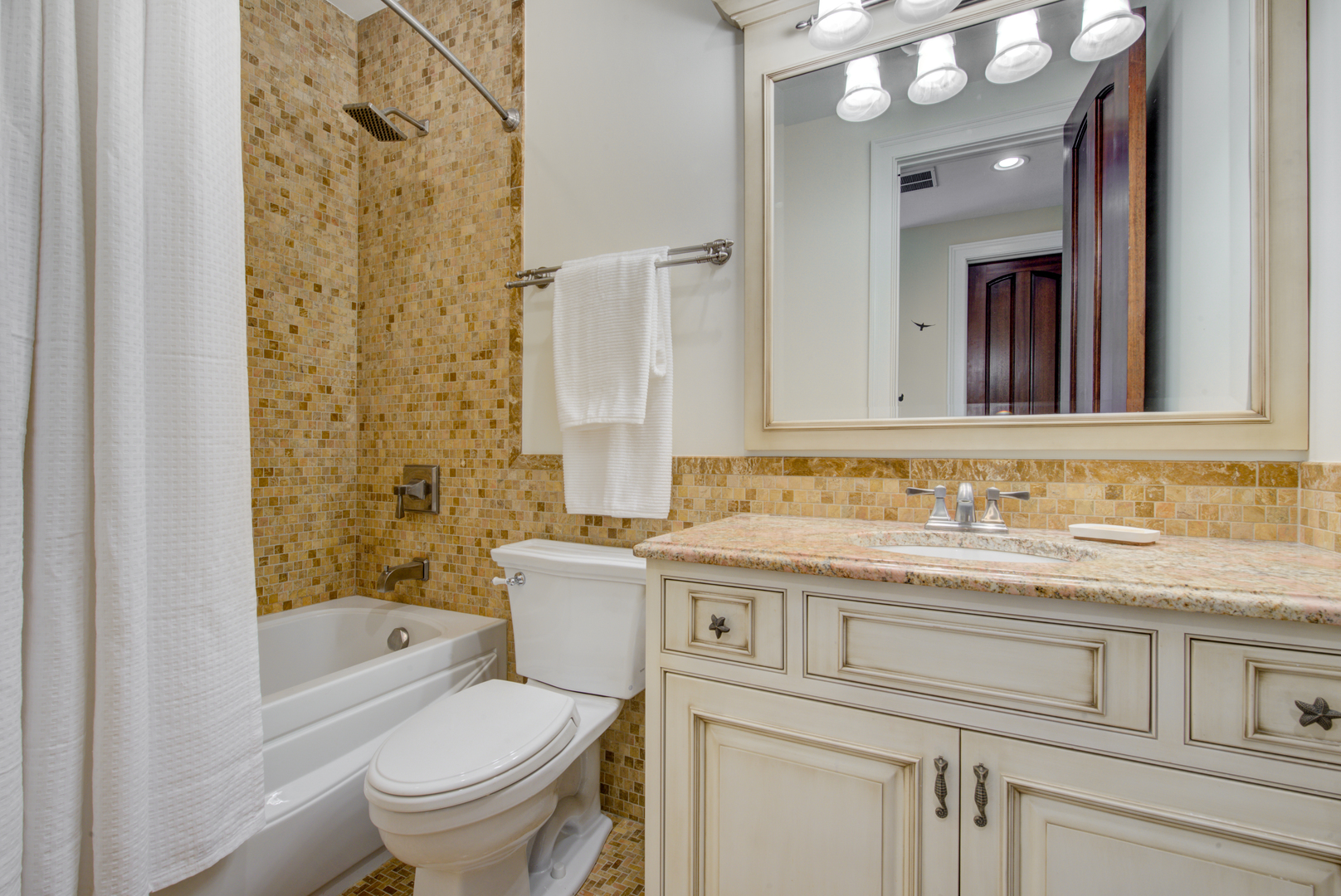 102 Longmeadow Road Winnetka, IL 60093 - Photo 36 of 52 a bathroom with a granite countertop toilet sink and mirror