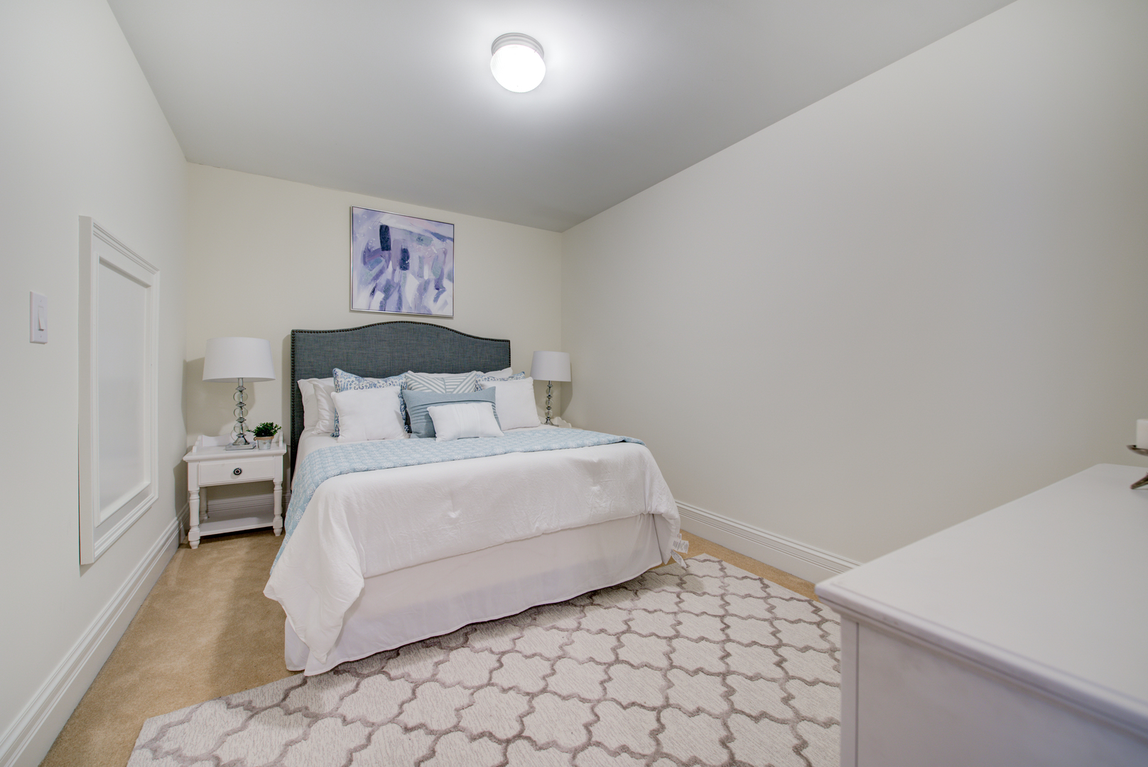 102 Longmeadow Road Winnetka, IL 60093 - Photo 41 of 52 a bedroom with a bed and a wall painting