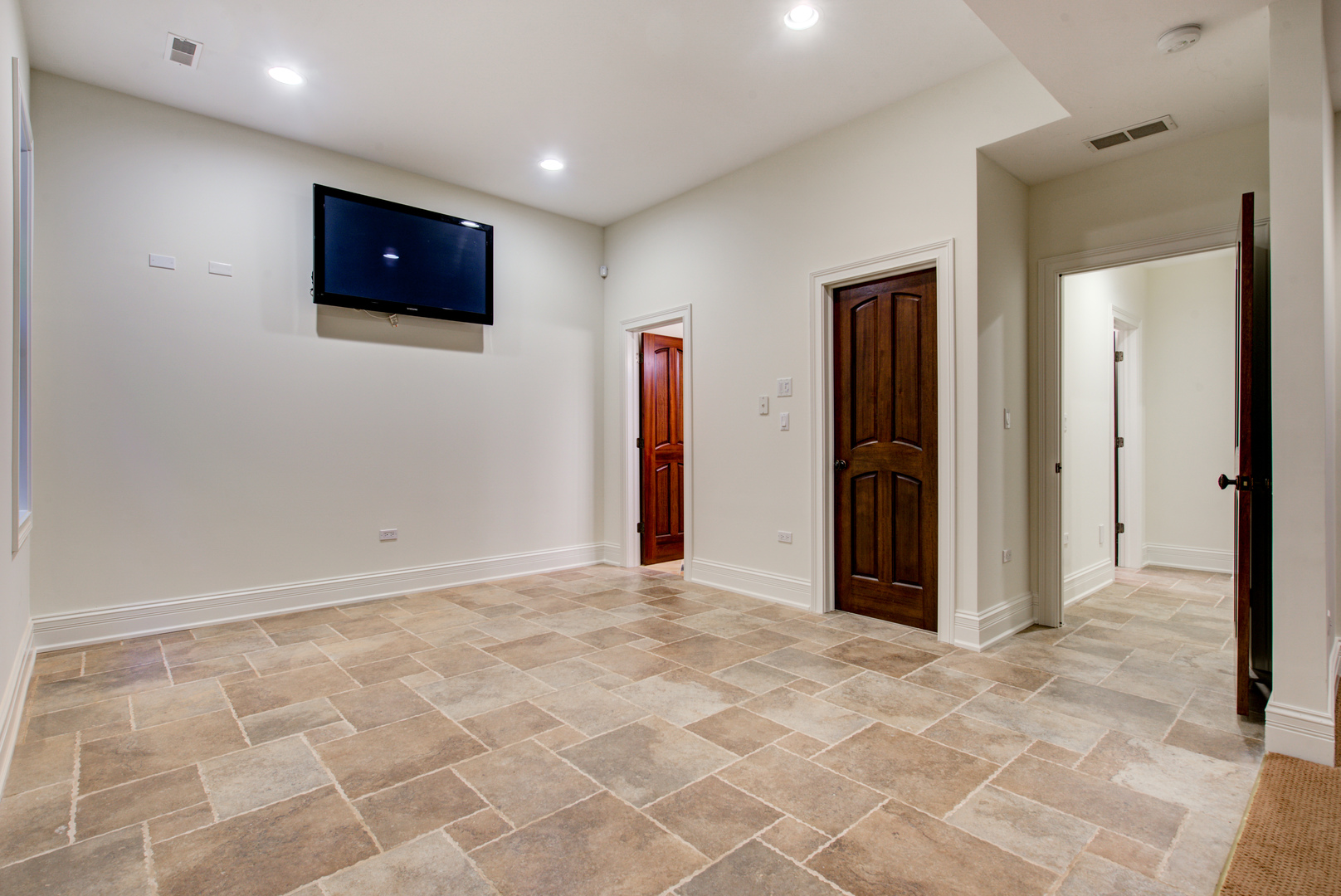 102 Longmeadow Road Winnetka, IL 60093 - Photo 51 of 52 a view of an empty room with a flat screen tv