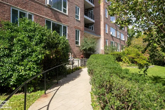 a view of a pathway both side of the house
