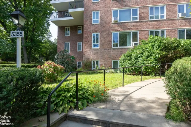a view of house with backyard and garden