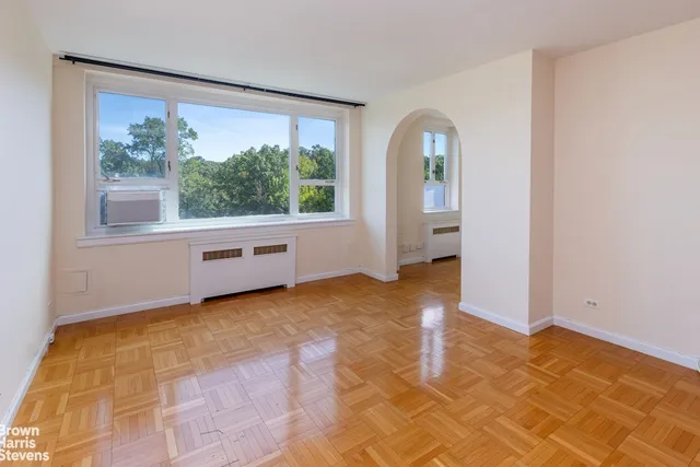 a view of an empty room with a window