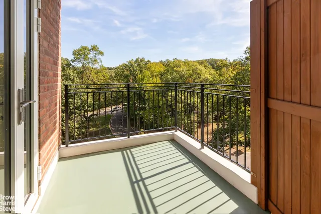 a view of a balcony with an outdoor space