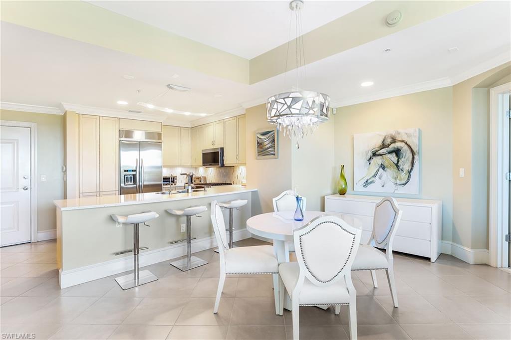 9115 Strada Place, Unit 5414 Naples, FL 34108 - Photo 3 of 26 a very nice looking dining room with furniture