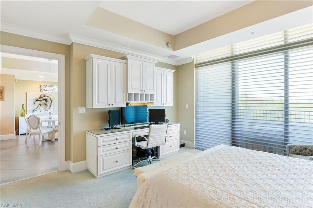 9115 Strada Place, Unit 5414 Naples, FL 34108 - Photo 6 of 26 a bedroom with a large bed and a window