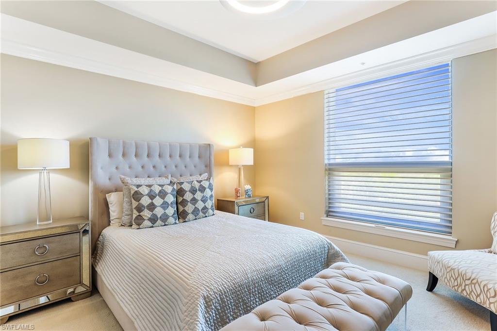 9115 Strada Place, Unit 5414 Naples, FL 34108 - Photo 10 of 26 a bedroom with a bed and a couch