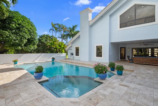 a view of swimming pool with a yard