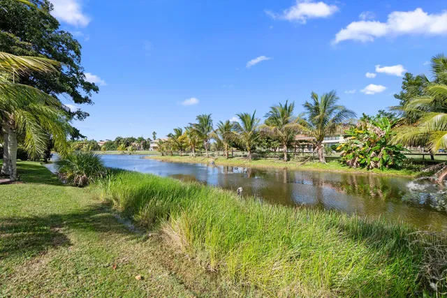 a view of house with outdoor space and garden