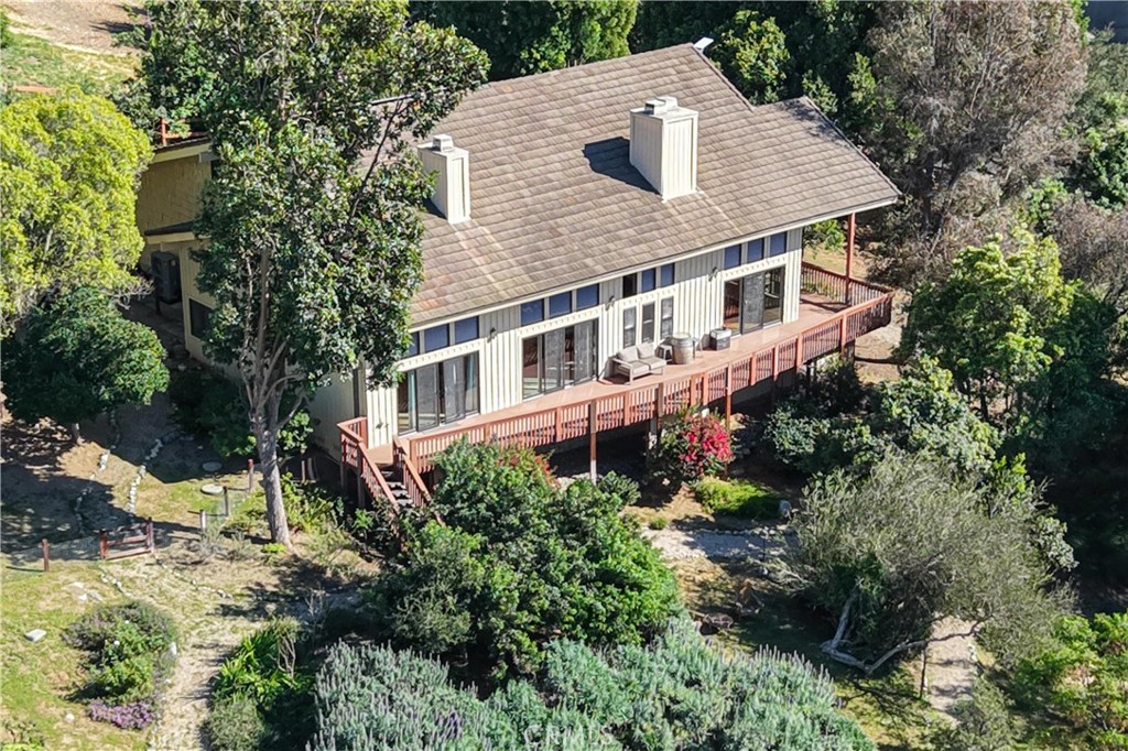 2248 Mil Sorpresas Drive Fallbrook, CA 92028 - Photo 12 of 74 a aerial view of a house with a yard and large trees