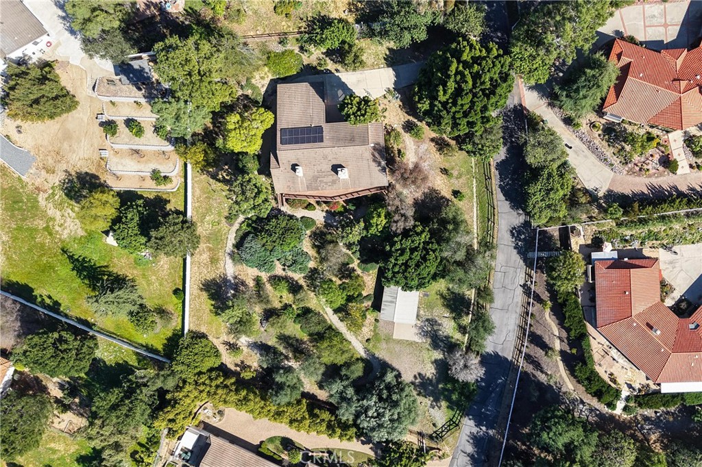 2248 Mil Sorpresas Drive Fallbrook, CA 92028 - Photo 14 of 74 an aerial view of a house with a yard and garden