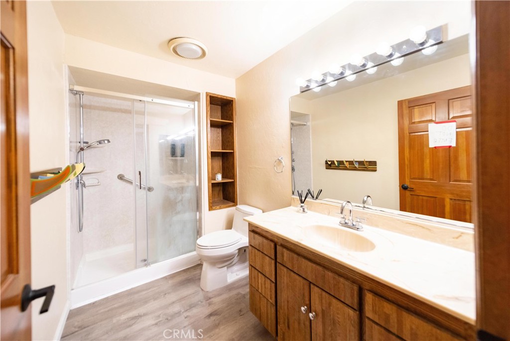 2248 Mil Sorpresas Drive Fallbrook, CA 92028 - Photo 44 of 74 a bathroom with a sink a toilet and shower