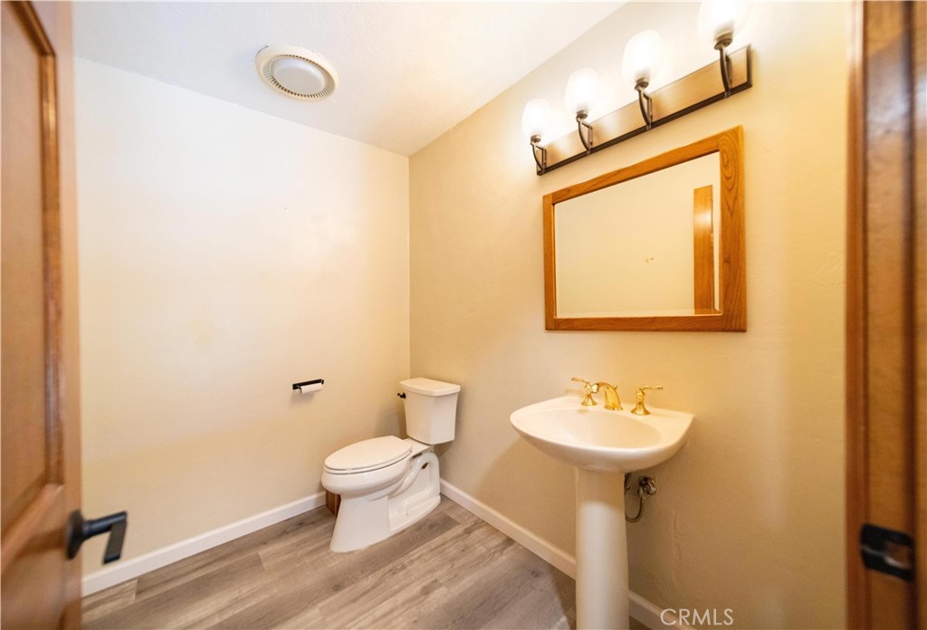 2248 Mil Sorpresas Drive Fallbrook, CA 92028 - Photo 58 of 74 a bathroom with a sink toilet and mirror