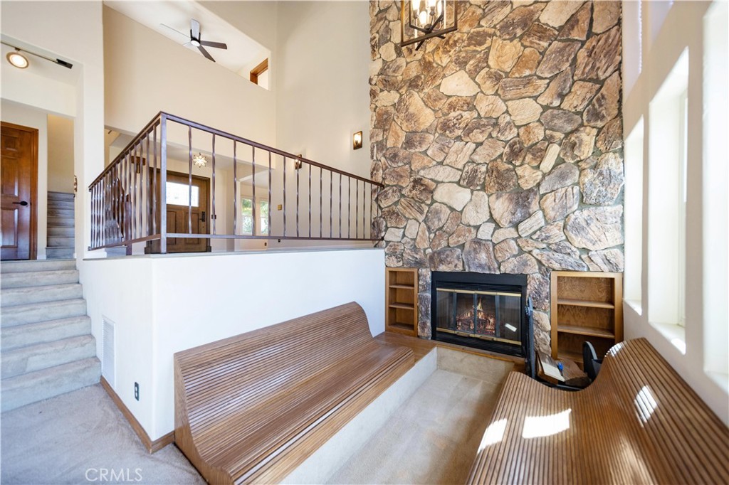 2248 Mil Sorpresas Drive Fallbrook, CA 92028 - Photo 59 of 74 a view of a livingroom with wooden floor and a fireplace