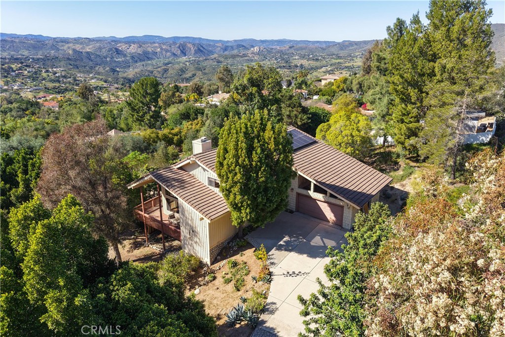 2248 Mil Sorpresas Drive Fallbrook, CA 92028 - Photo 7 of 74 an aerial view of a house with a yard and mountain