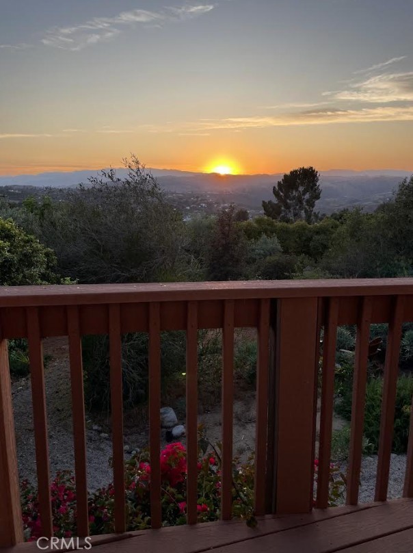 2248 Mil Sorpresas Drive Fallbrook, CA 92028 - Photo 71 of 74 a view of a balcony with wooden fence and floor