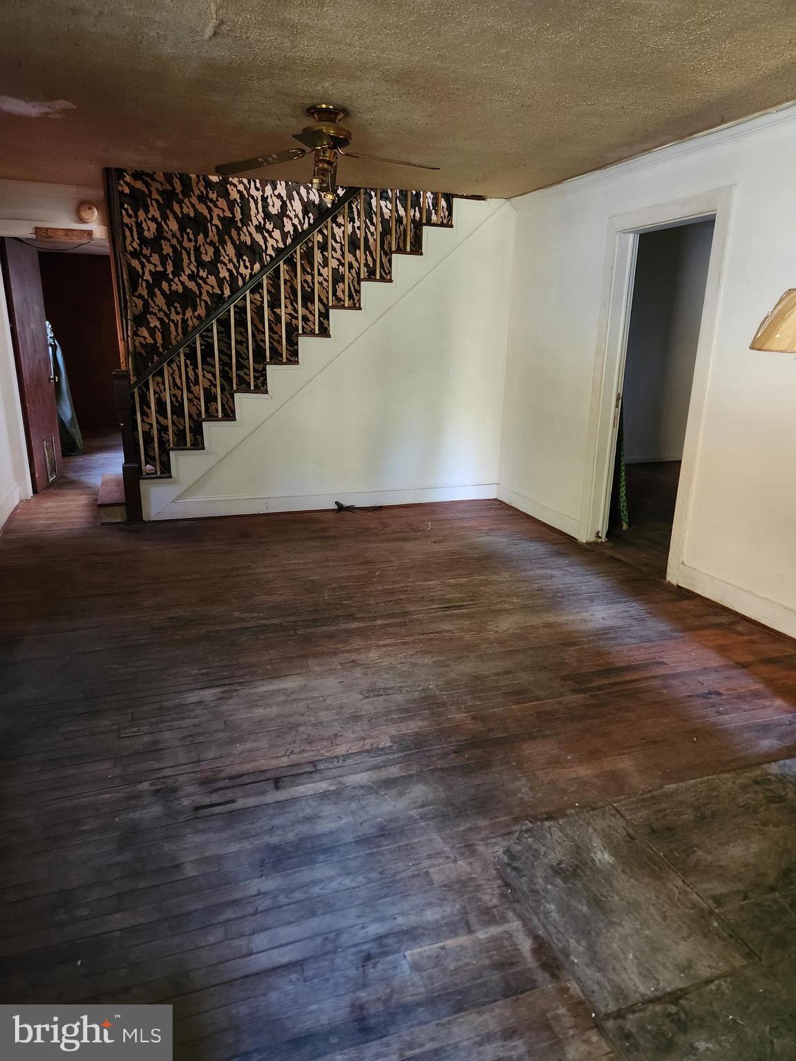 2138 Back Creek Road Gore, VA 22637 - Photo 11 of 32 living room with staircase