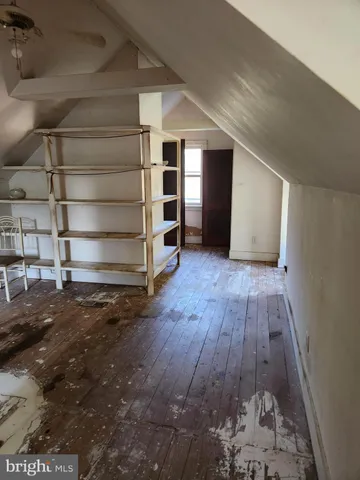 a view of an empty room with a fireplace