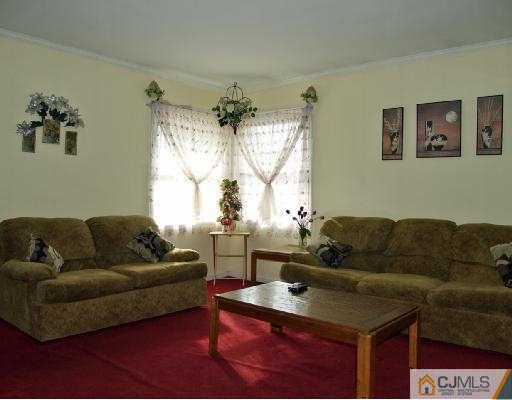 18 Brookville Road Edison, NJ 08817 - Photo 1 of 8 a living room with furniture and a window